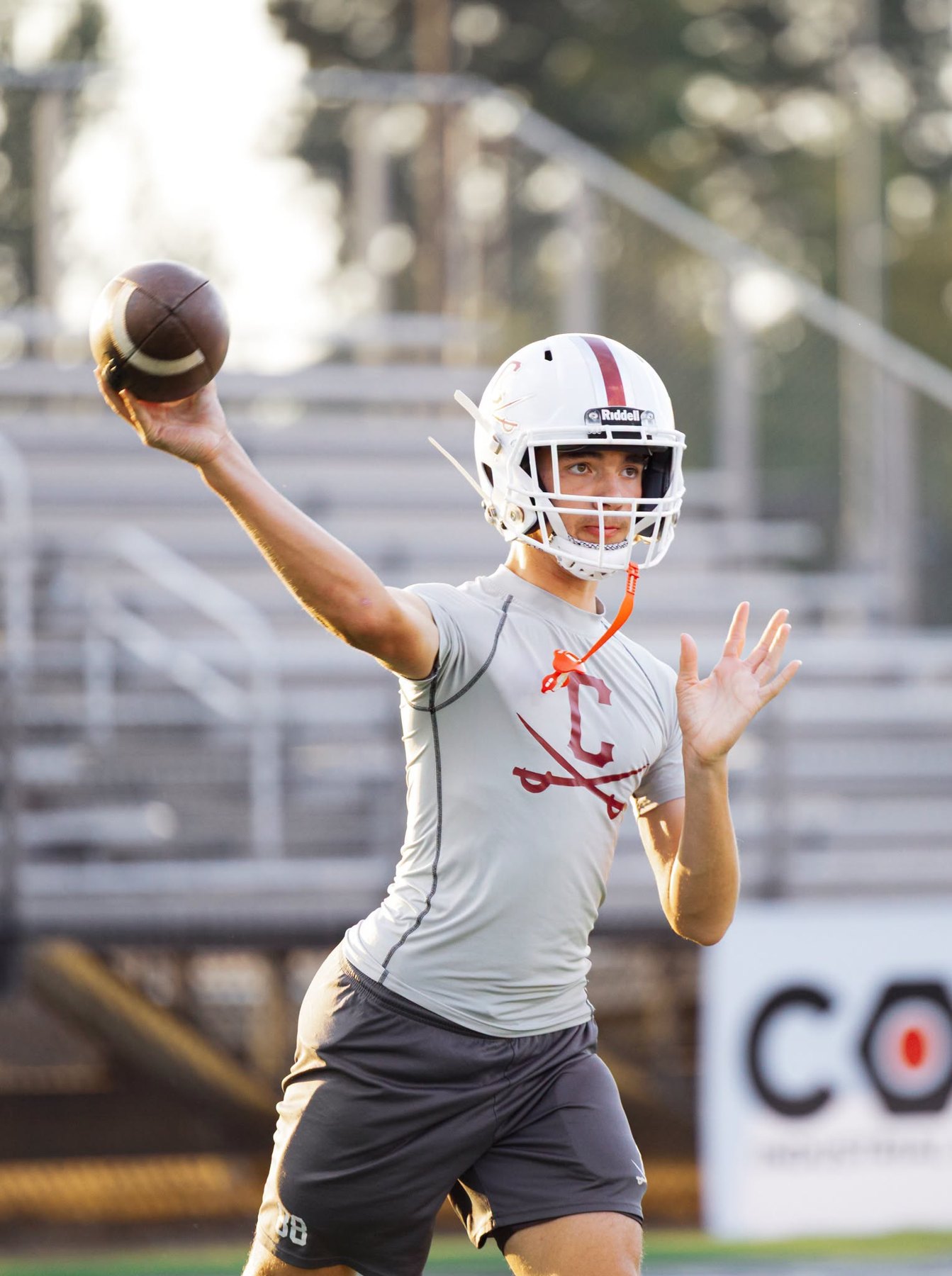 A Caledonia player throws during warm-ups before the game