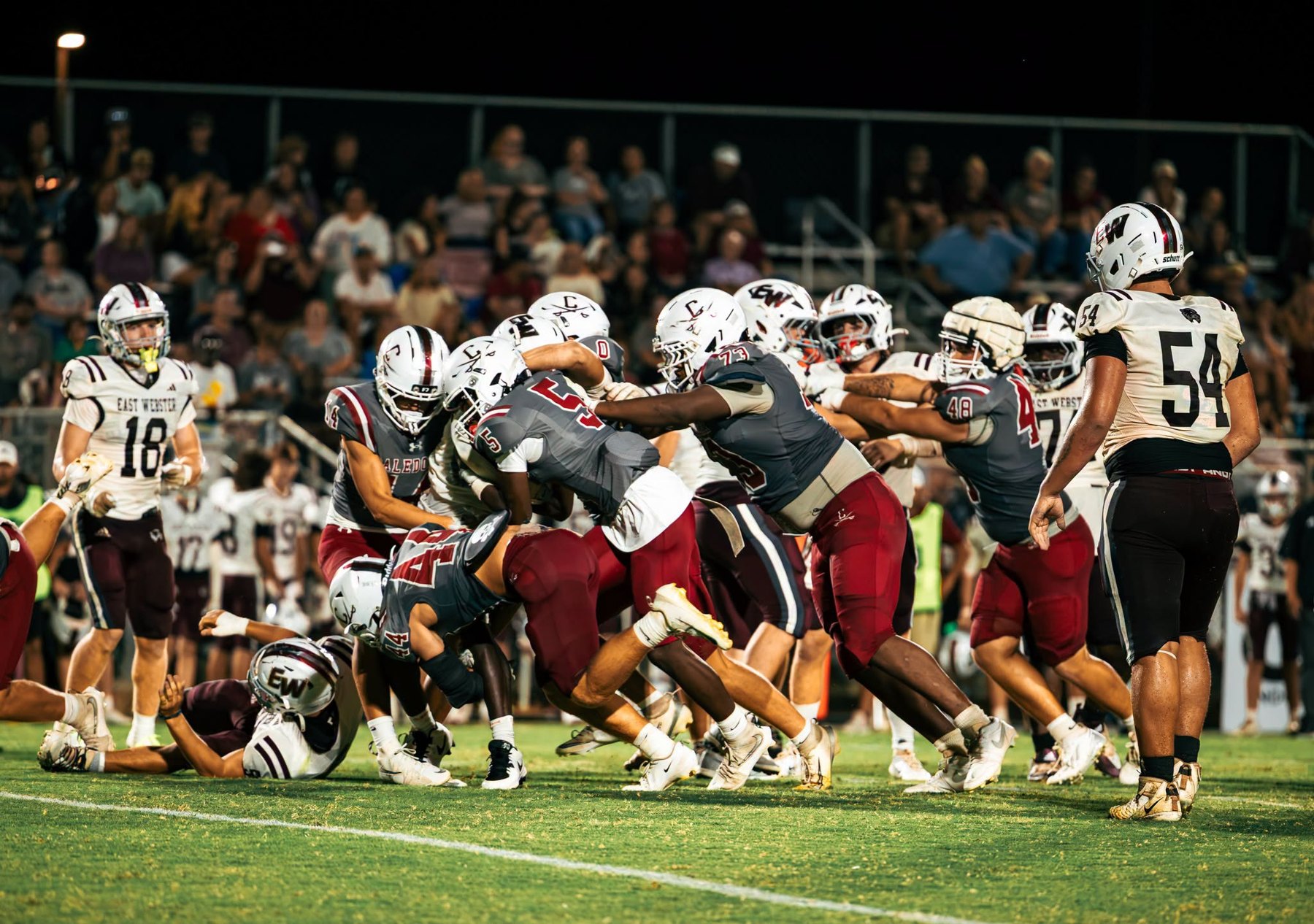 Caledonia and East Webster collide in a pile at the line of scrimmage