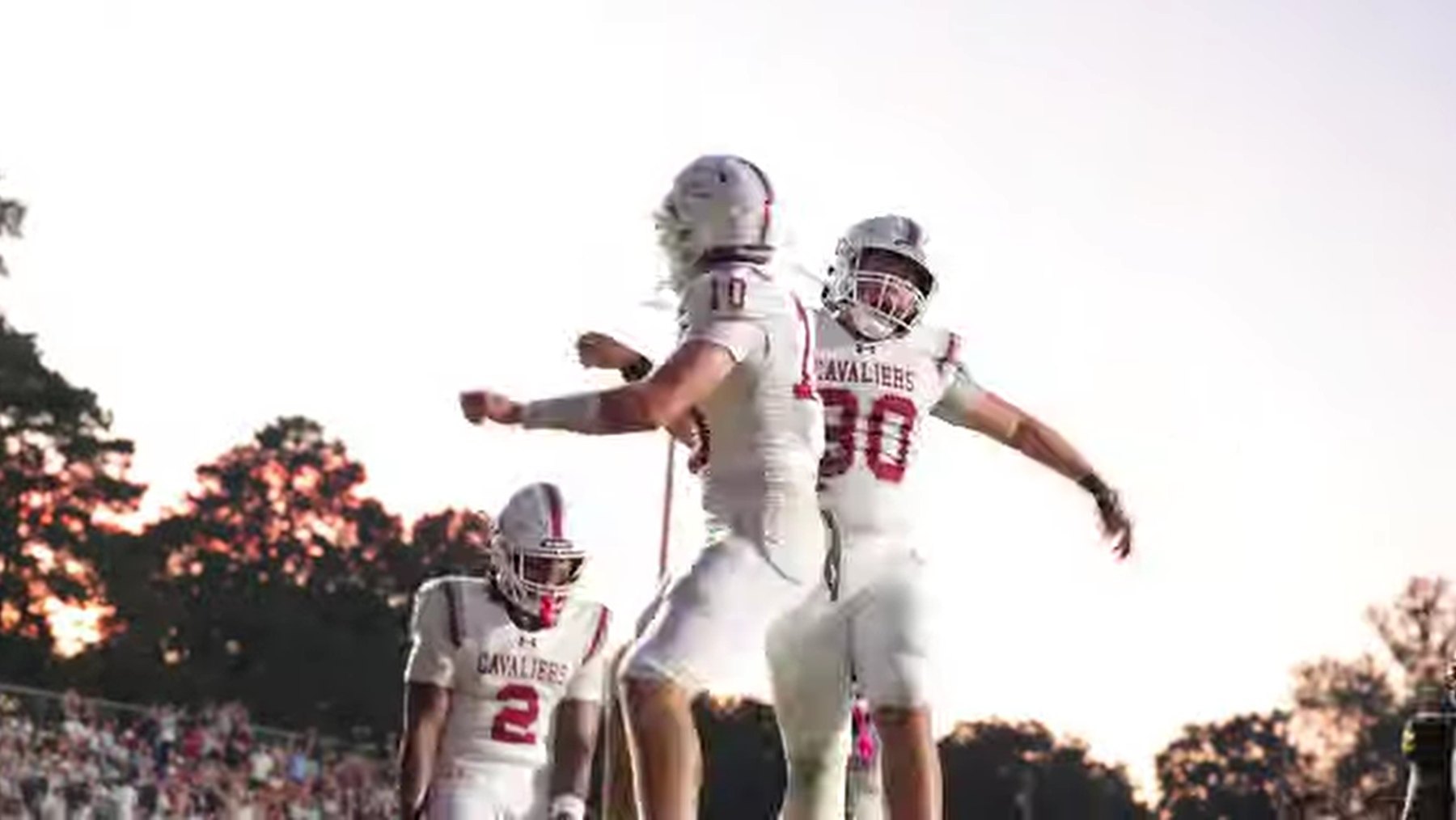 Two Caledonia players leap to celebrate