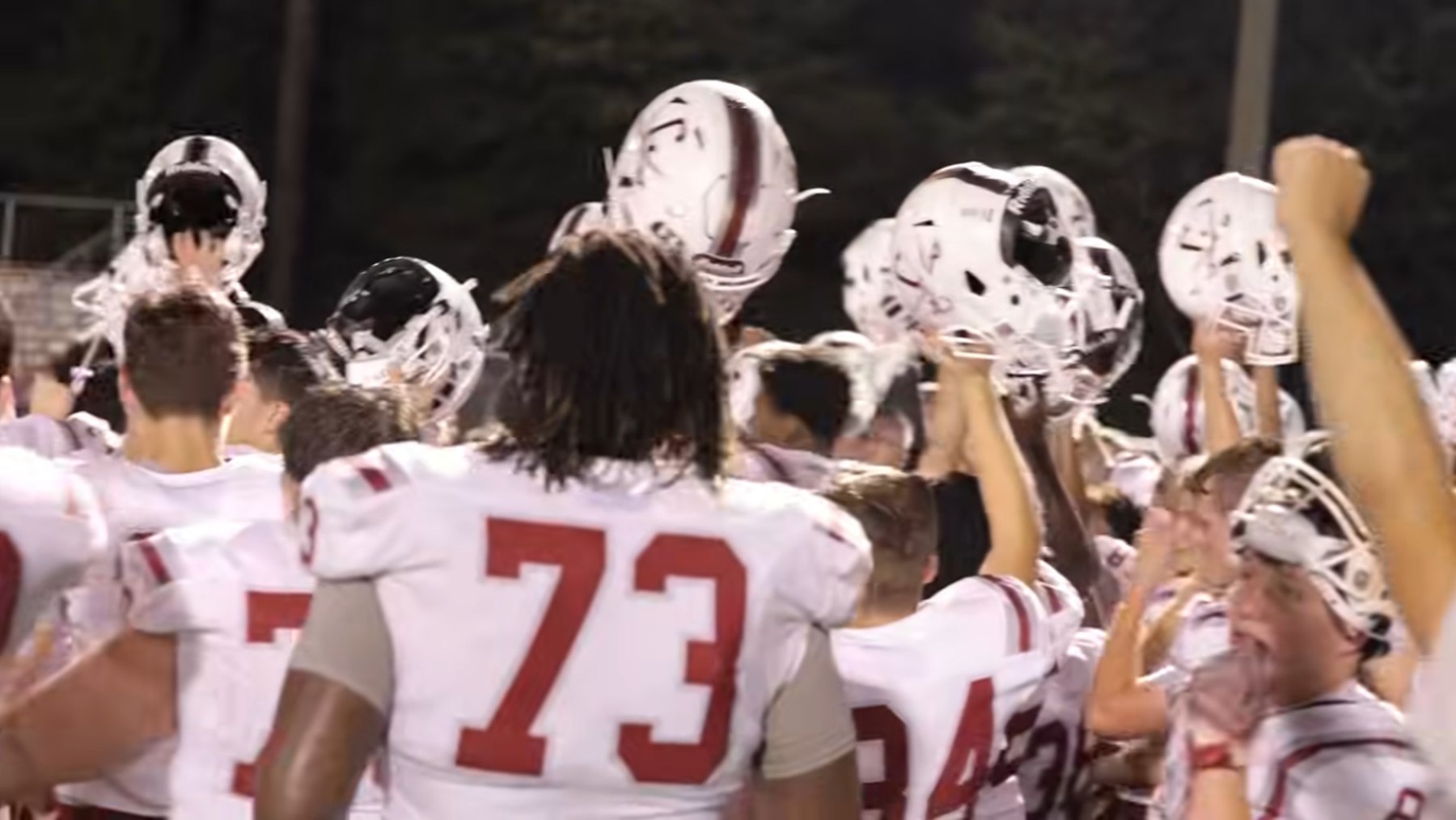 Caledonia's players raise their helmets after the game at Lamar